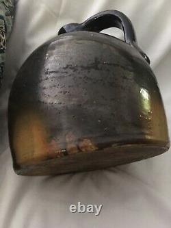 Antique brown glazed Stoneware crock jug. Approx. 9h with base diameter 8