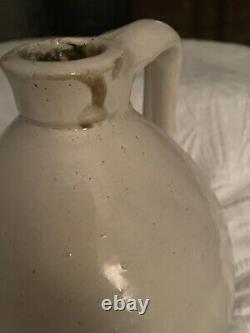 Antique stoneware jug crock with handle
