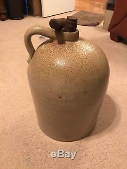 Antique stoneware jug decorated with bee sting print