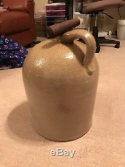 Antique stoneware jug decorated with bee sting print